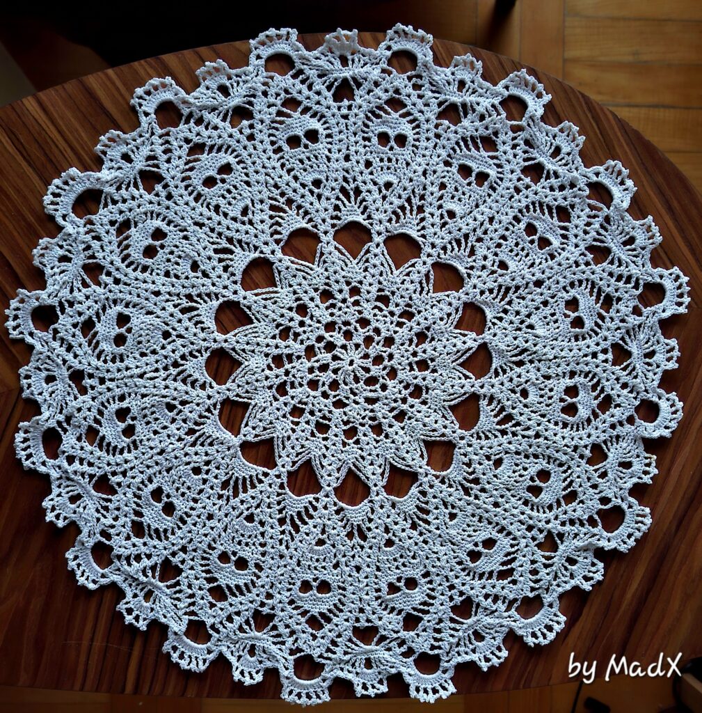 crocheted doily with skulls pattern